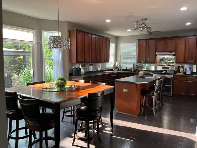 a view of a dining room with furniture window and wooden floor