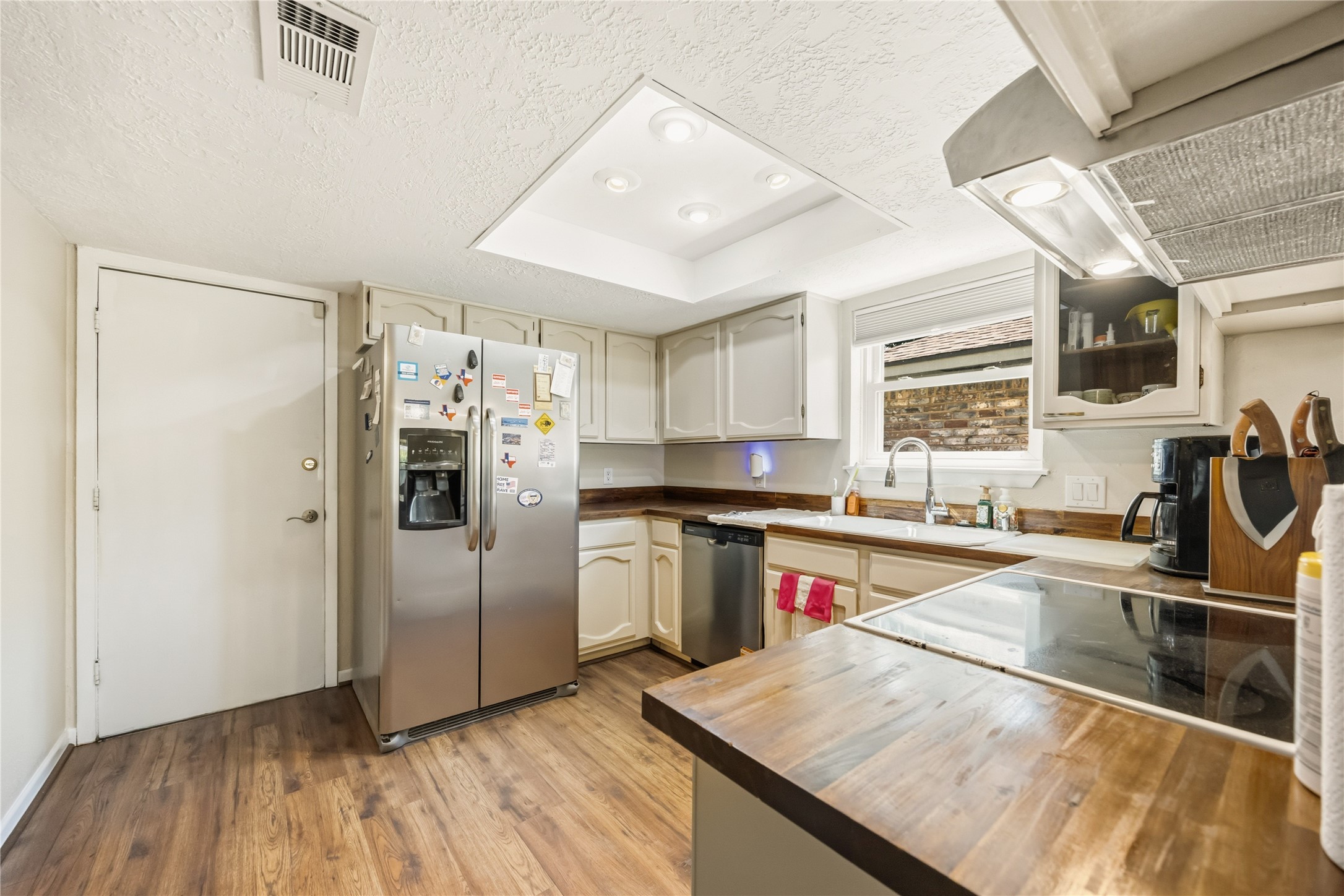 9635 Birsay Street Spring, TX 77379 - Photo 8 of 24 a kitchen with stainless steel appliances granite countertop a refrigerator and a sink