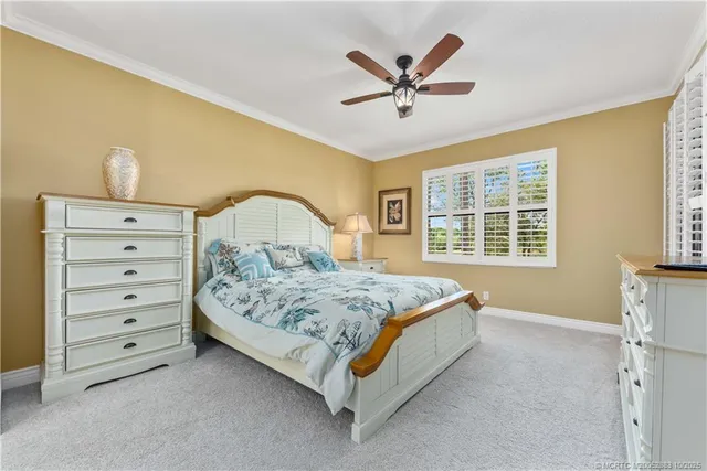 a bedroom with a bed a window and closet