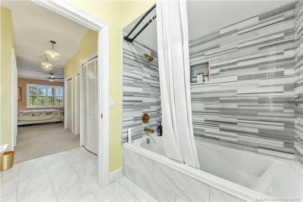 a bathroom with a bathtub and a shower