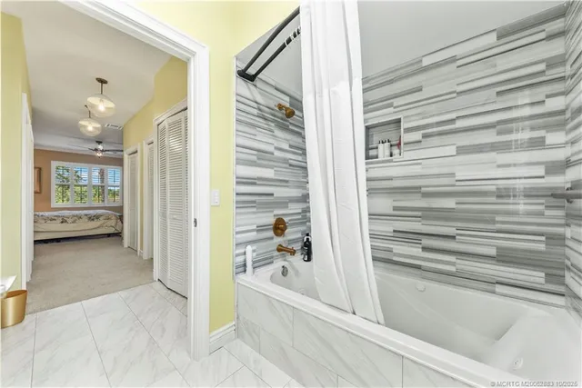 a bathroom with a bathtub and a shower