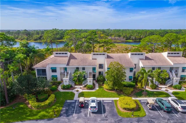 a view of a house with yard and outdoor seating