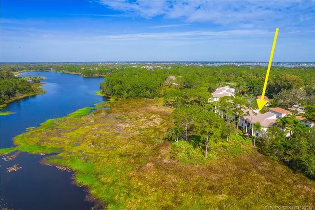 a view of a lake with a yard