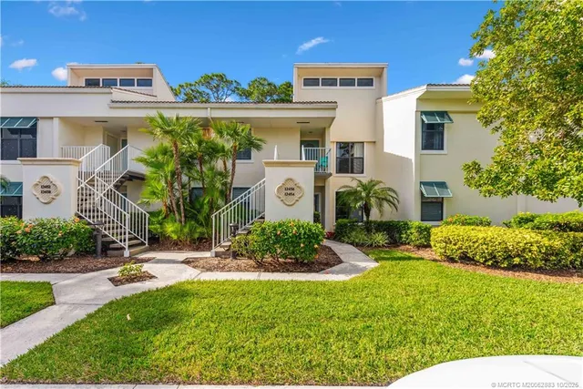 a front view of a building with garden