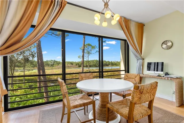 a view of a dining room with furniture window and outside view