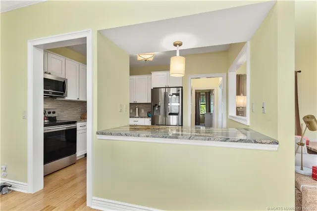 a view of a kitchen and a window