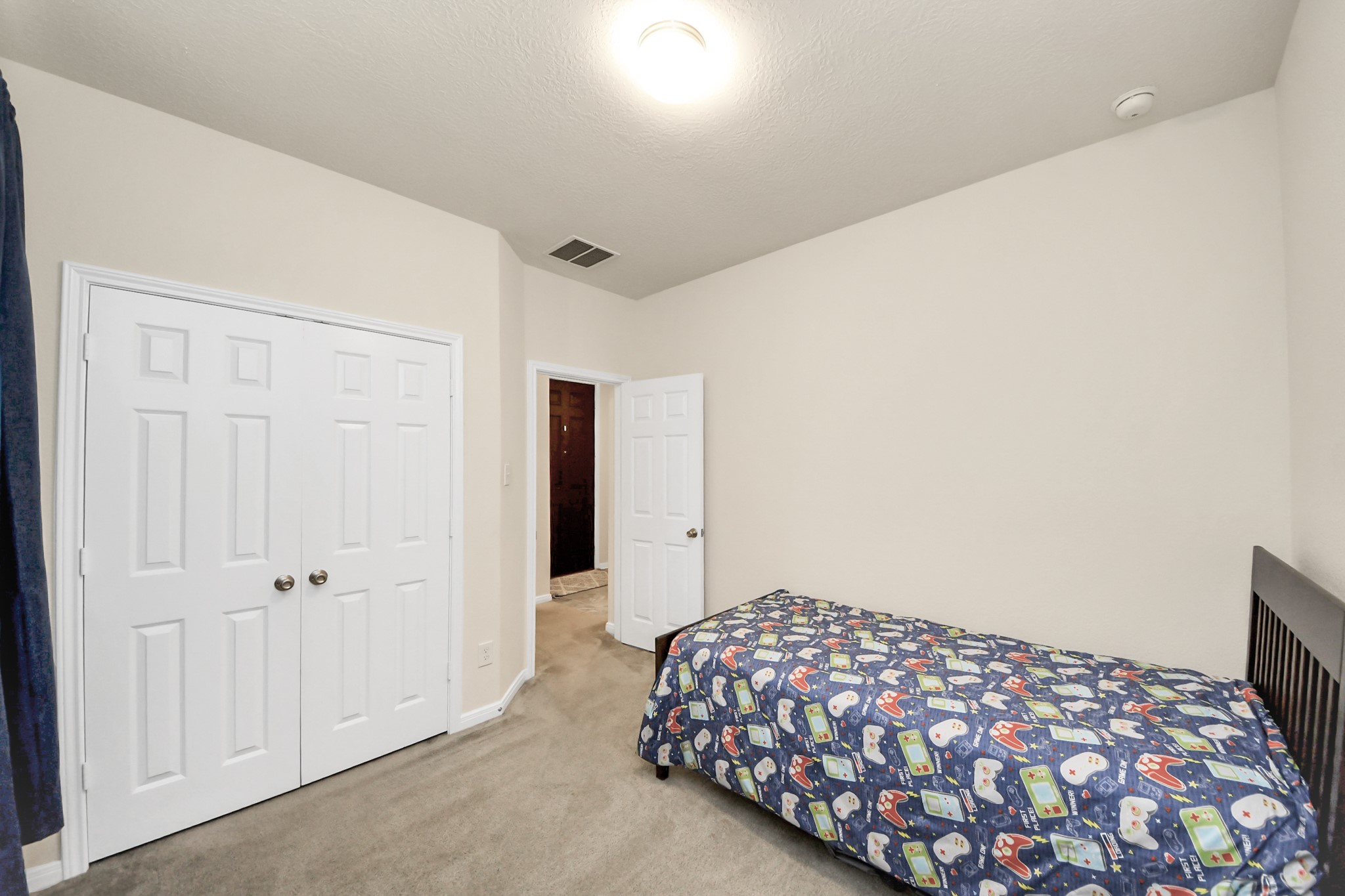20830 Cullen Ranch Road Katy, TX 77449 - Photo 14 of 20 a bedroom with a bed and a painting on the wall