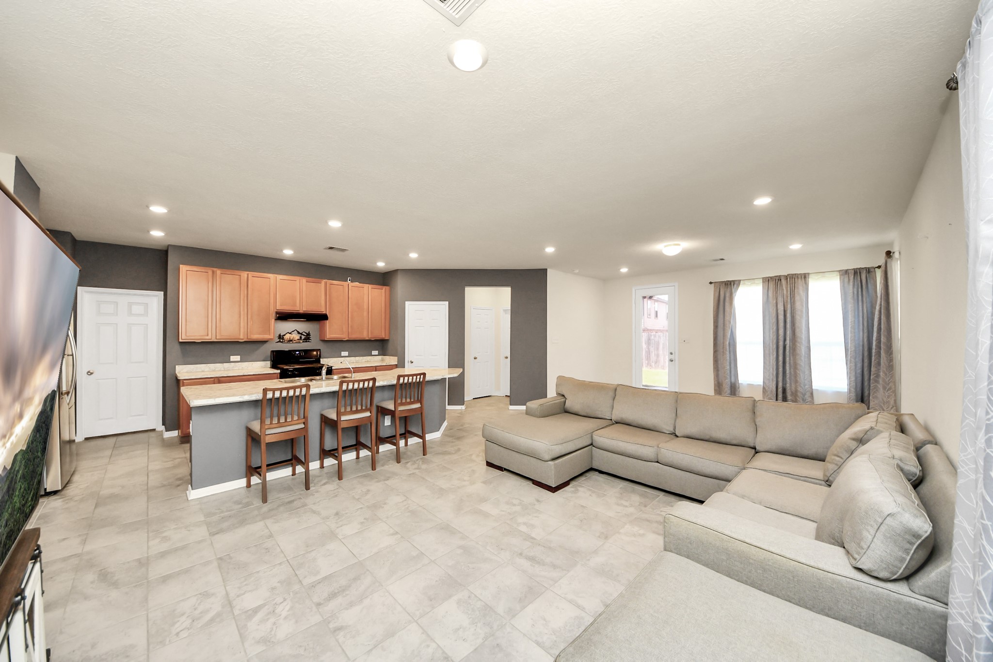 20830 Cullen Ranch Road Katy, TX 77449 - Photo 2 of 20 a living room with furniture and kitchen view