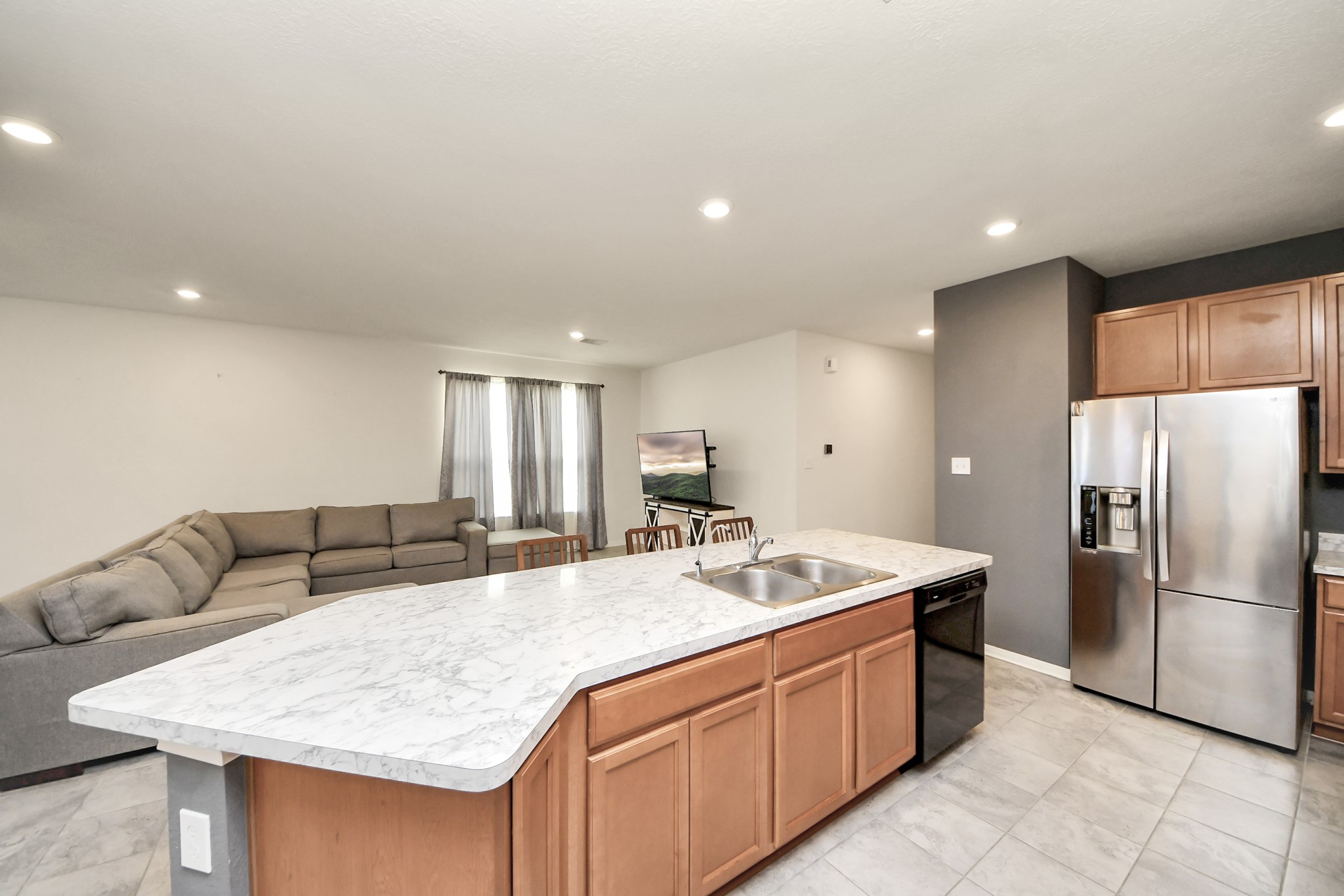 20830 Cullen Ranch Road Katy, TX 77449 - Photo 5 of 20 a kitchen with stainless steel appliances granite countertop a sink refrigerator and cabinets