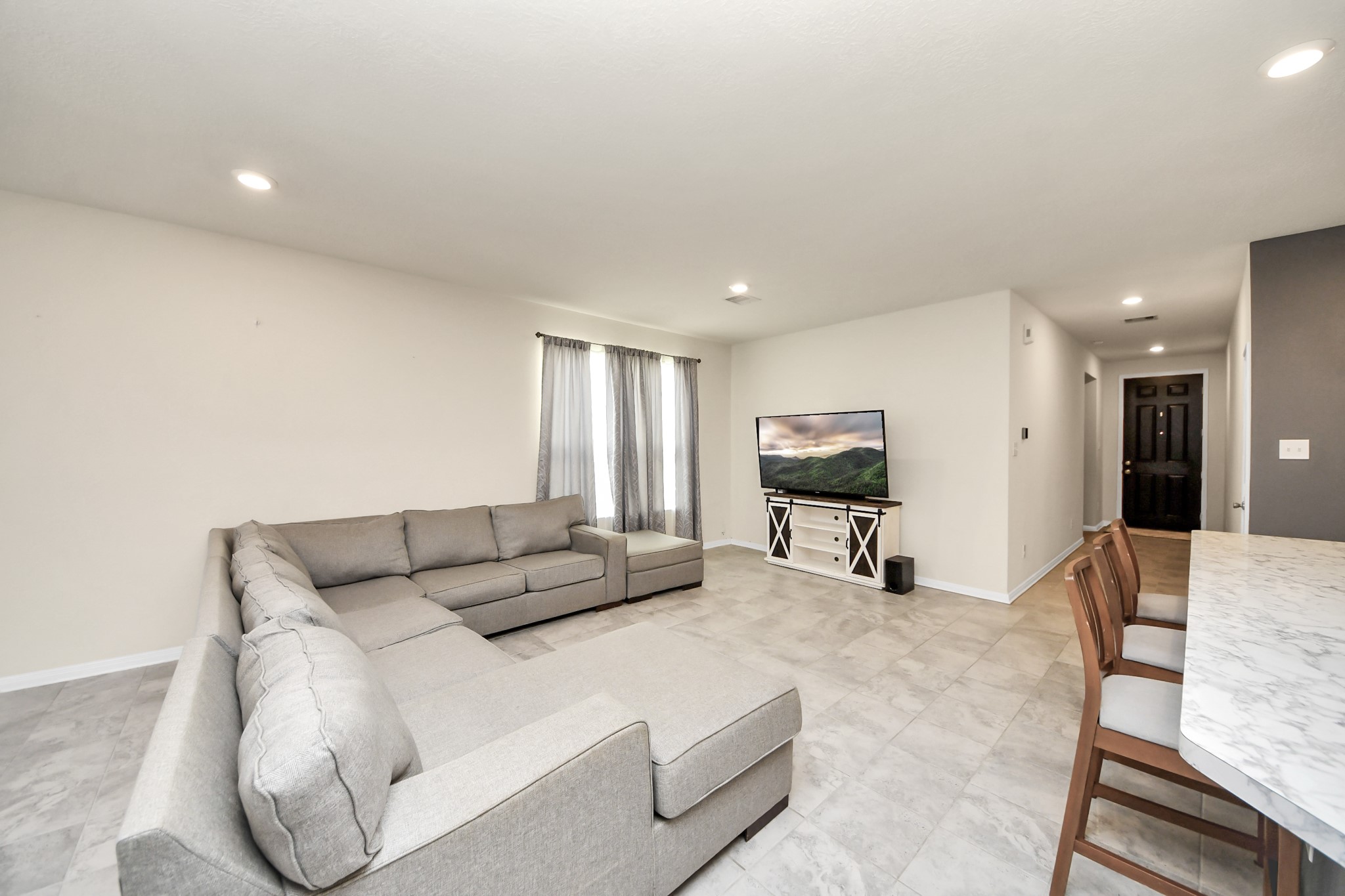 20830 Cullen Ranch Road Katy, TX 77449 - Photo 8 of 20 a living room with furniture and a flat screen tv