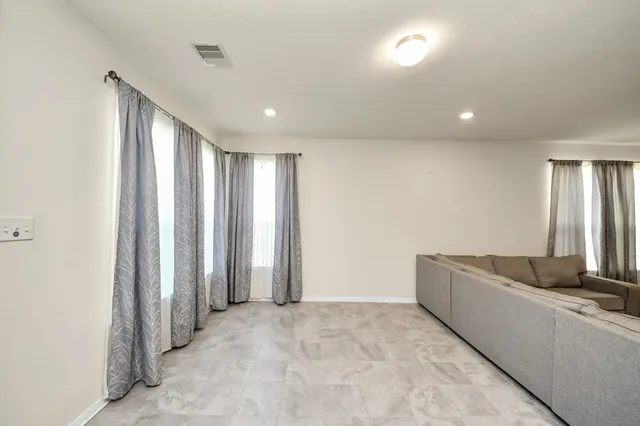 a view of a livingroom with a staircase