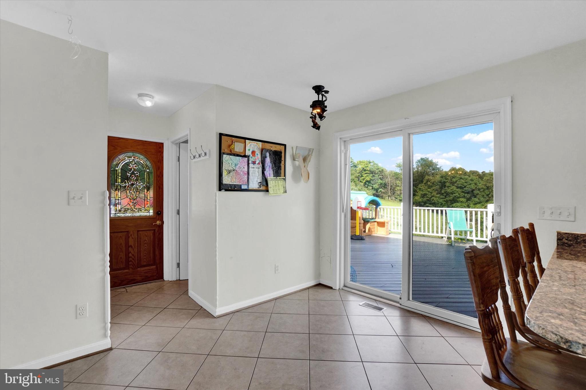 243 Bald Eagle Road Fawn Grove, PA 17321 - Photo 11 of 44 a view of a hallway with furniture and floor to ceiling window