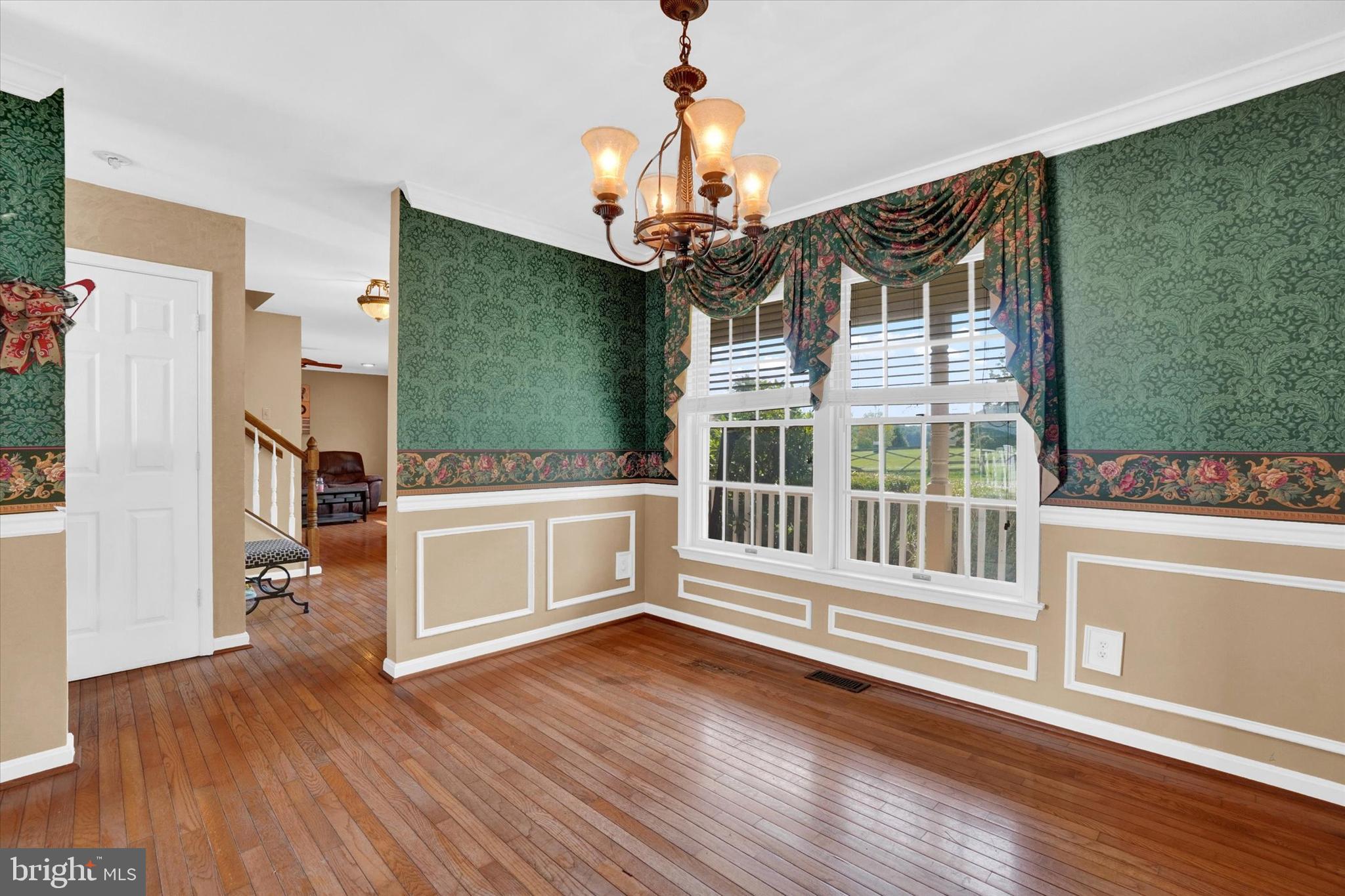 243 Bald Eagle Road Fawn Grove, PA 17321 - Photo 16 of 44 a view of a livingroom with wooden floor and a ceiling fan