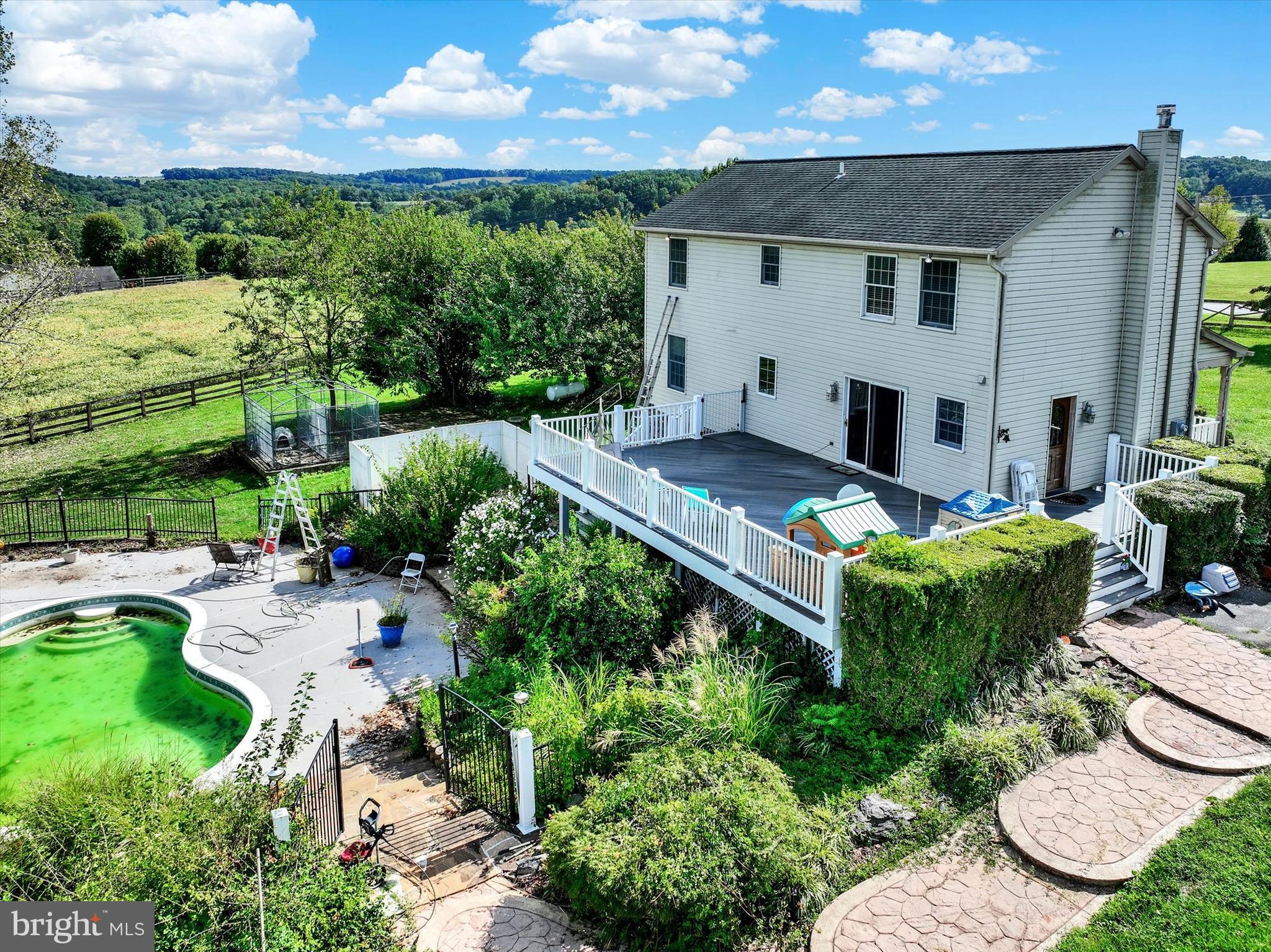 243 Bald Eagle Road Fawn Grove, PA 17321 - Photo 28 of 44 a view of a patio with table and chairs potted plants
