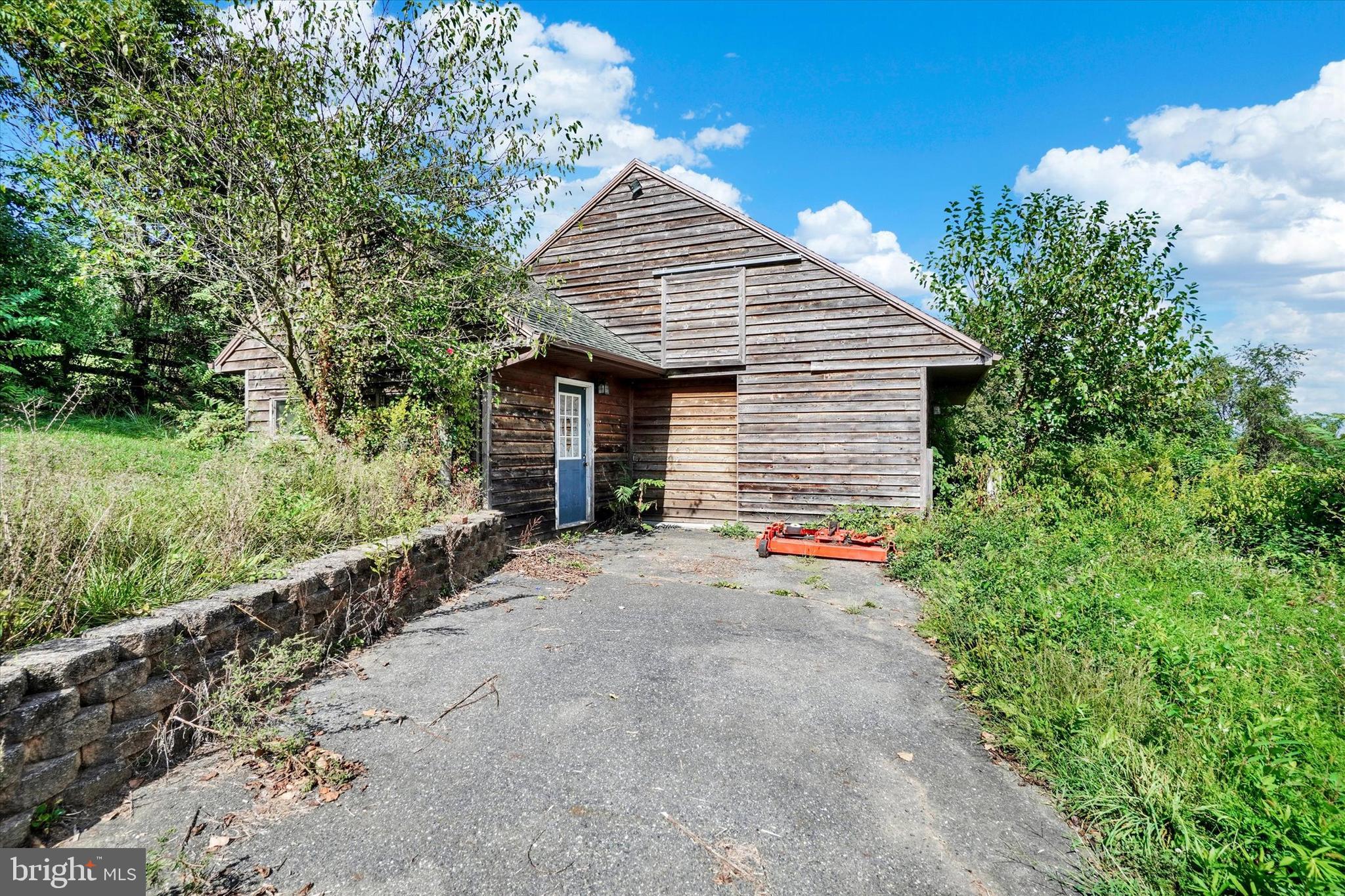 243 Bald Eagle Road Fawn Grove, PA 17321 - Photo 30 of 44 a view of a house with a small yard and a large tree