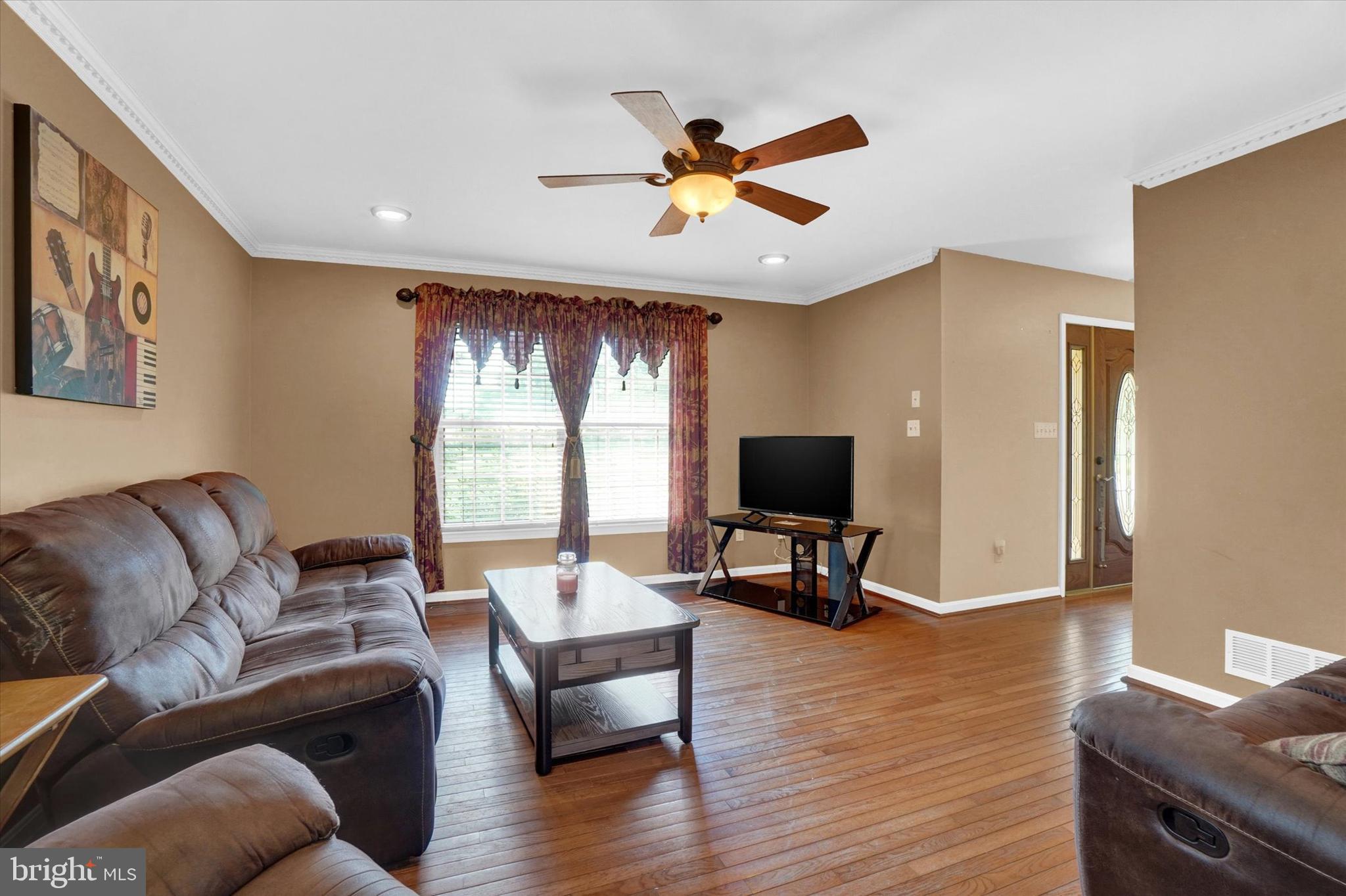 243 Bald Eagle Road Fawn Grove, PA 17321 - Photo 5 of 44 a living room with furniture and a flat screen tv