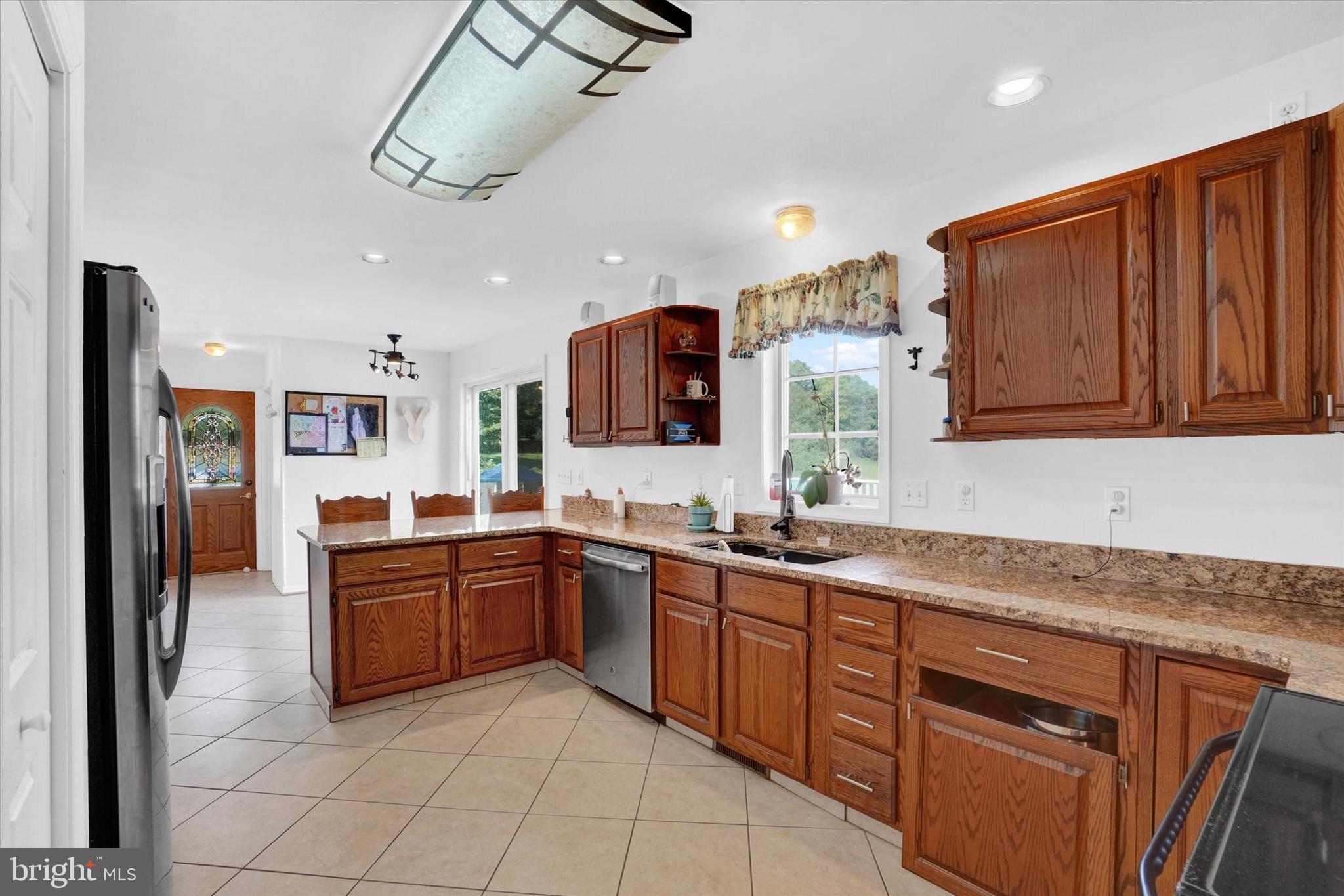 243 Bald Eagle Road Fawn Grove, PA 17321 - Photo 8 of 44 a kitchen with stainless steel appliances granite countertop wooden cabinets a sink and dishwasher