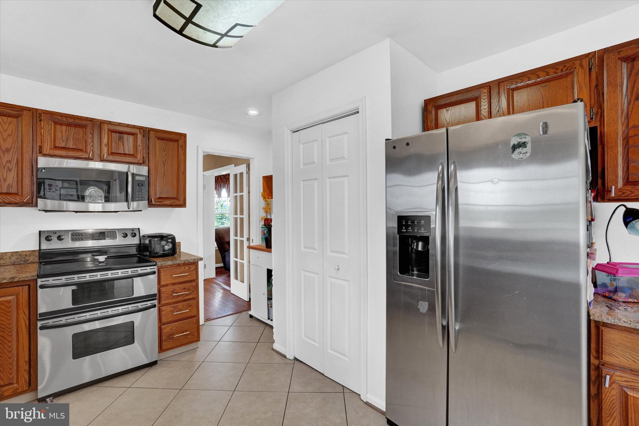 243 Bald Eagle Road Fawn Grove, PA 17321 - Photo 9 of 44 a kitchen with stainless steel appliances a refrigerator and a stove top oven