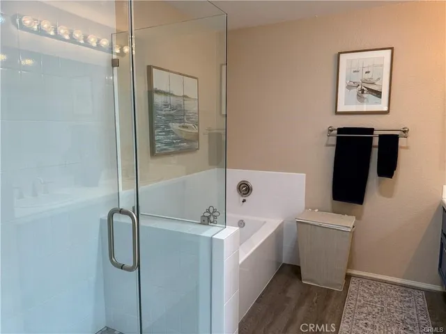 a bathroom with double vanity sink a mirror and a toilet