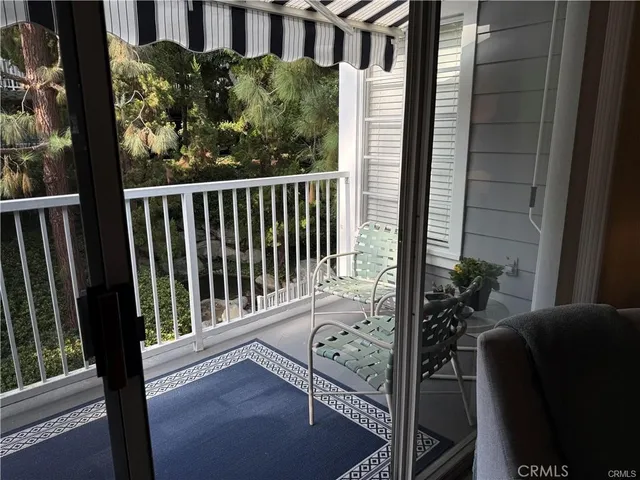 a view of balcony with a floor to ceiling window and stairs