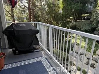a view of a wooden house with a yard and a garden