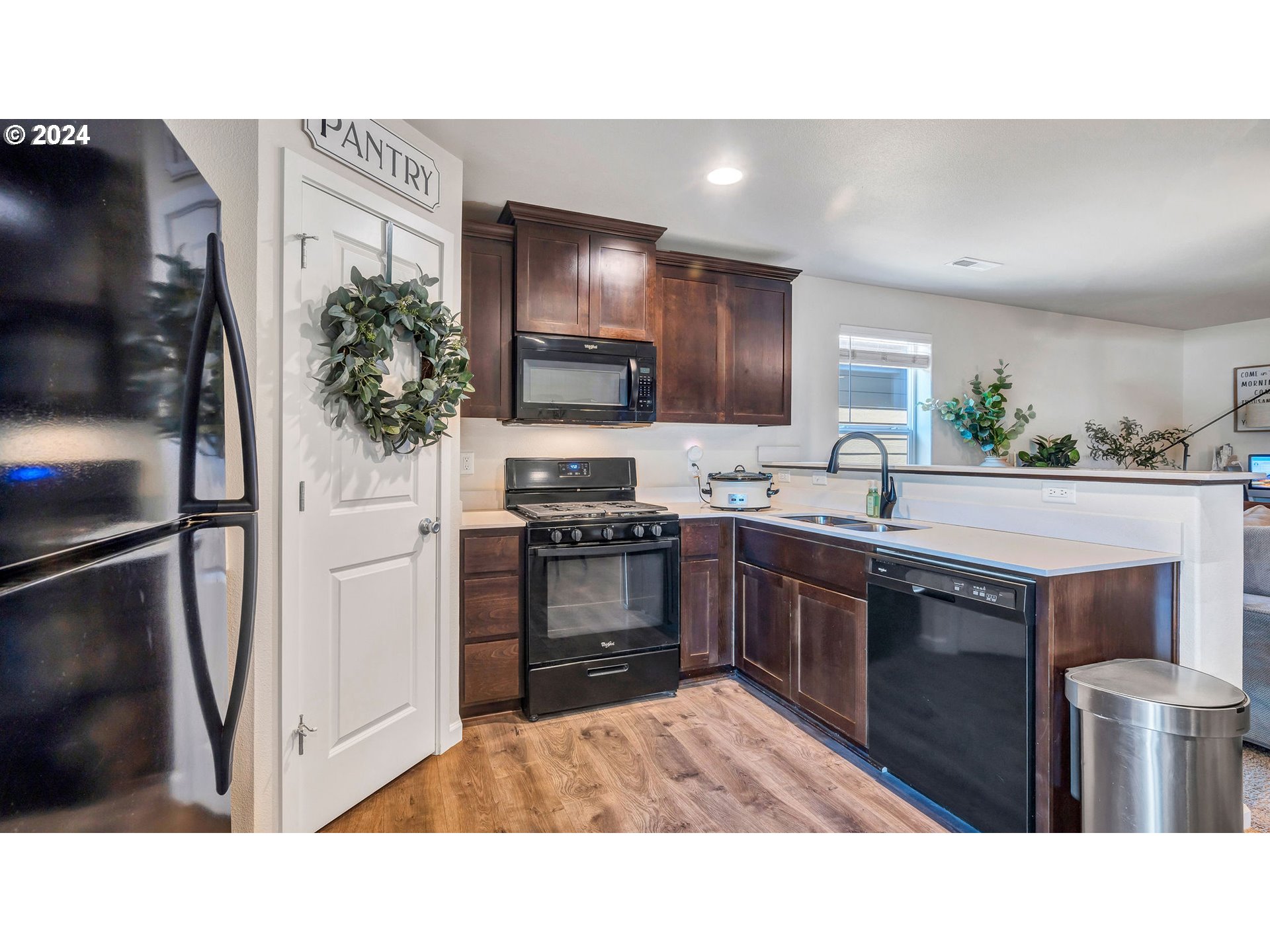 330 Forest Lane Molalla, OR 97038 - Photo 4 of 29 a kitchen with a refrigerator and a sink
