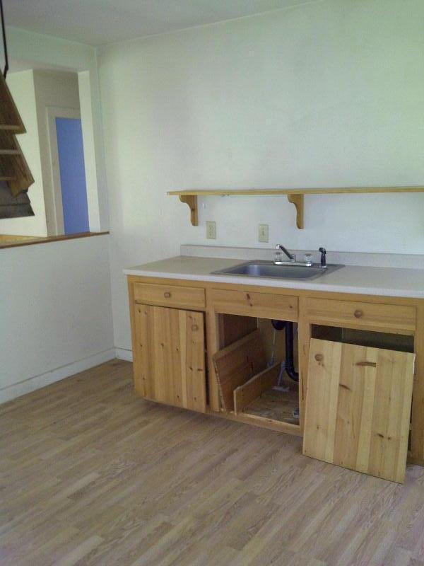 148 S Road Peru, MA 01235 - Photo 3 of 9 a view of a kitchen with a sink and a wooden floor