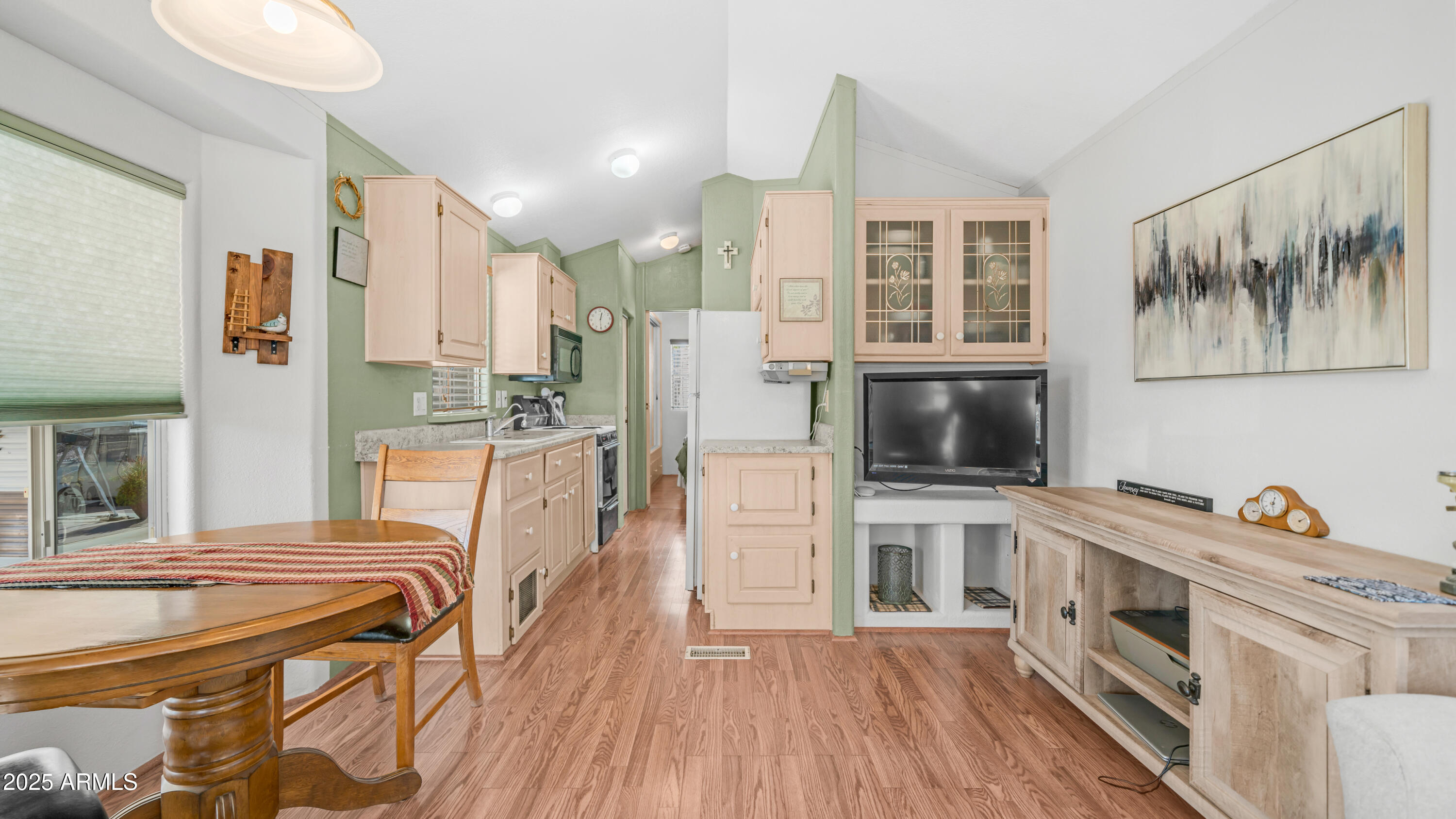 900 South Idaho Road, Unit 1106 Apache Junction, AZ 85119 - Photo 11 of 60 a kitchen with stainless steel appliances a stove a sink and a refrigerator