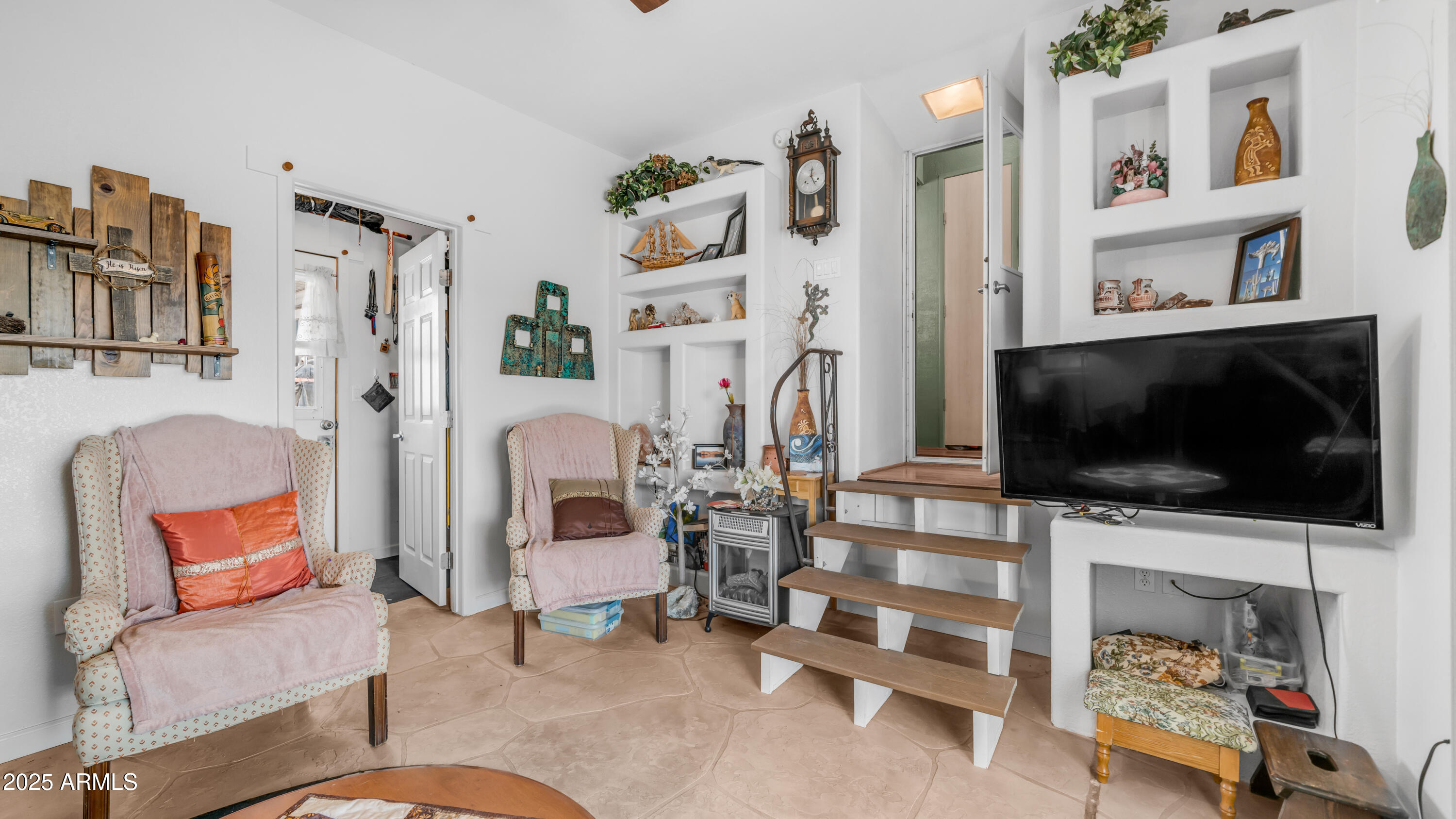 900 South Idaho Road, Unit 1106 Apache Junction, AZ 85119 - Photo 22 of 60 a living room with furniture and a flat screen tv