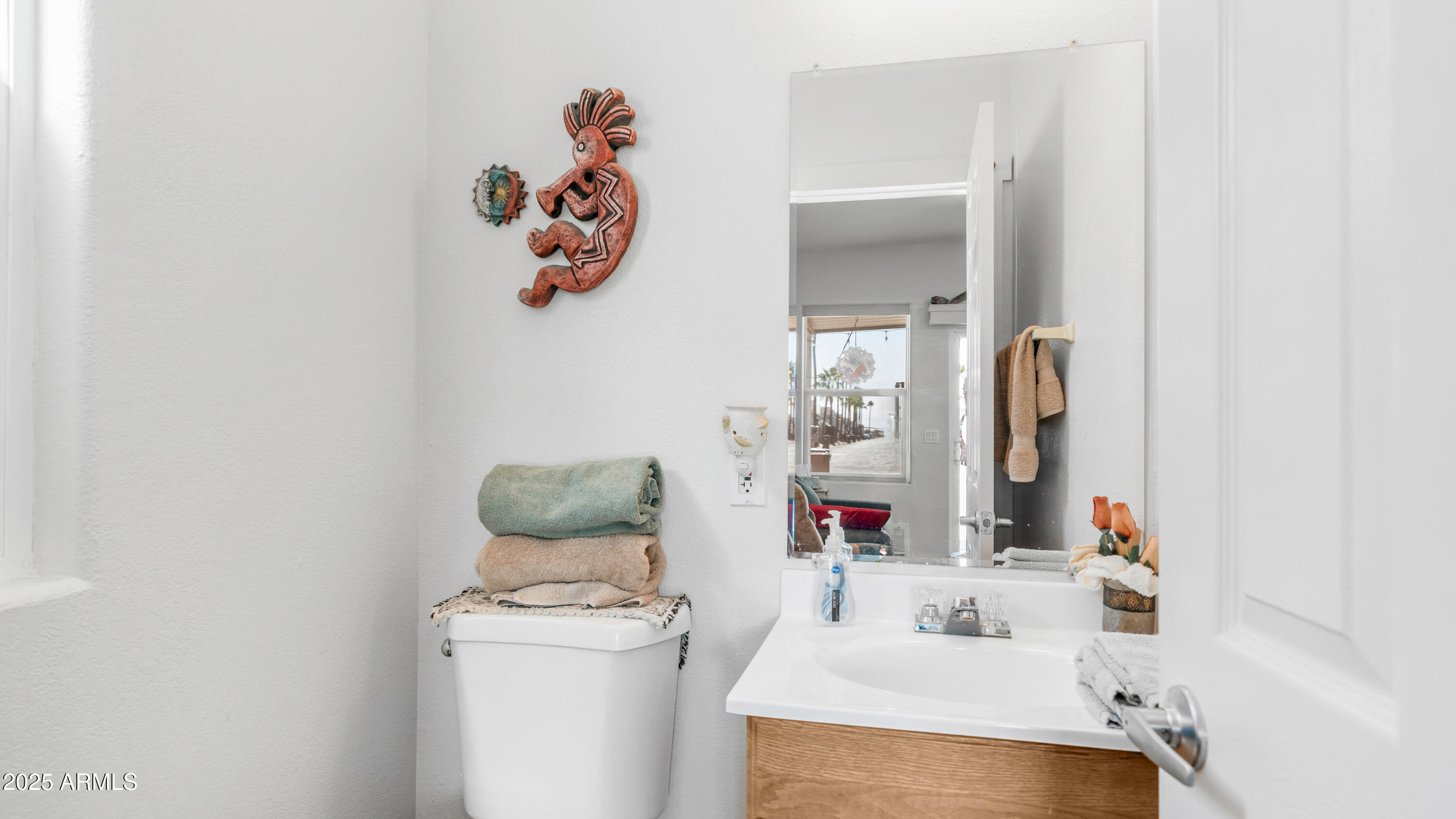 900 South Idaho Road, Unit 1106 Apache Junction, AZ 85119 - Photo 23 of 60 a bathroom with a sink and a mirror