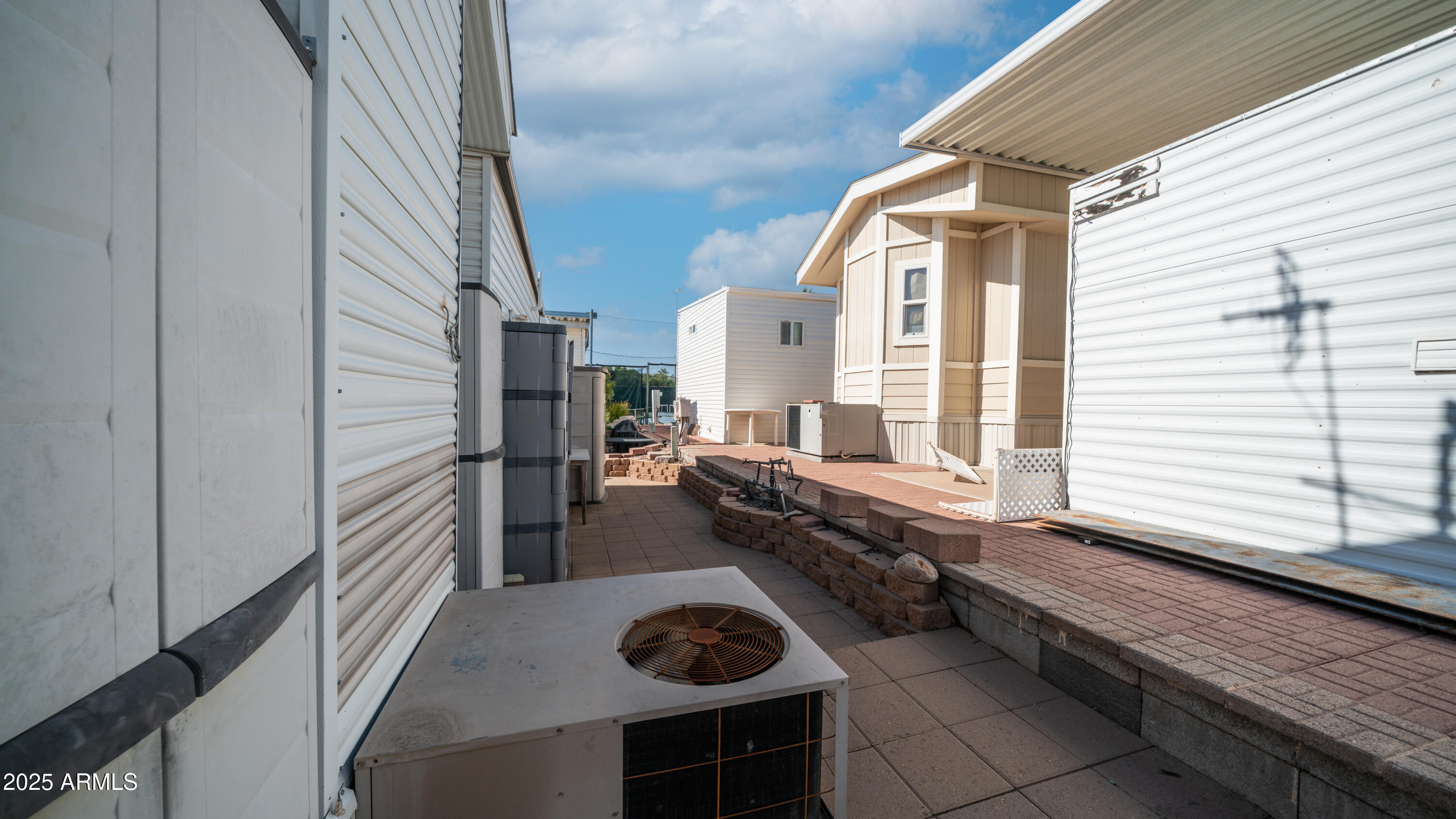 900 South Idaho Road, Unit 1106 Apache Junction, AZ 85119 - Photo 30 of 60 a kitchen with stainless steel appliances granite countertop a sink and a stove