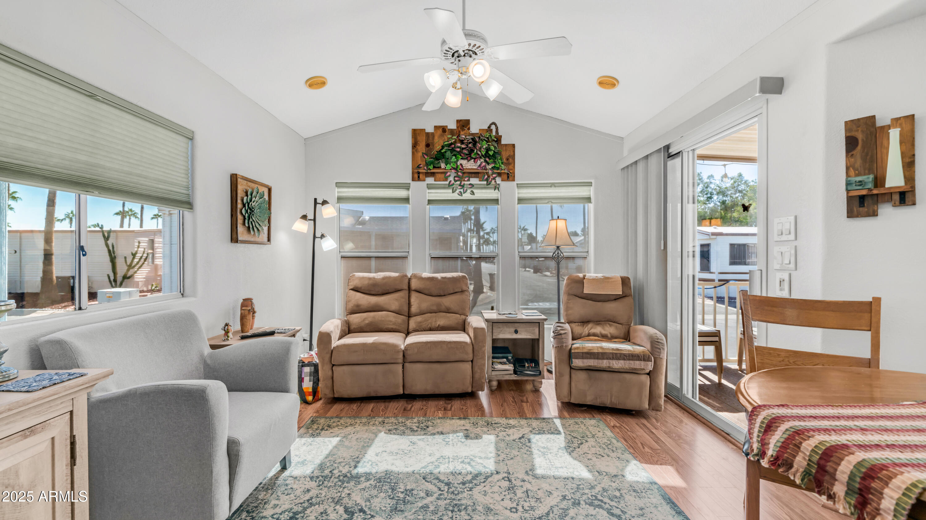 900 South Idaho Road, Unit 1106 Apache Junction, AZ 85119 - Photo 8 of 60 a living room with furniture and a chandelier