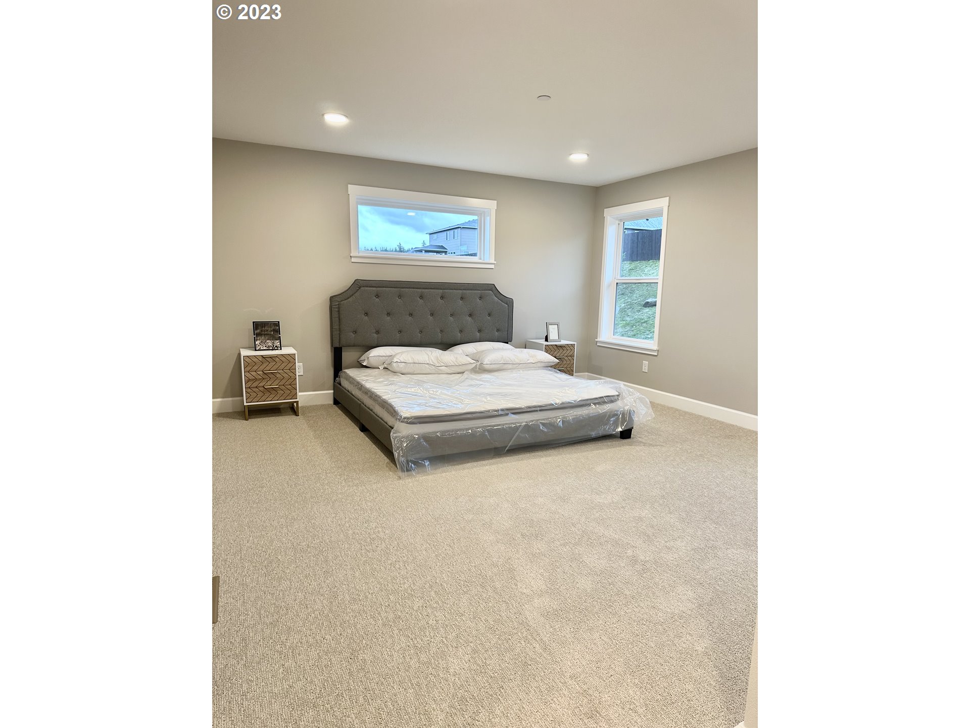 290 West Laurel Street Washougal, WA 98671 - Photo 15 of 20 a spacious bedroom with a bed and a window