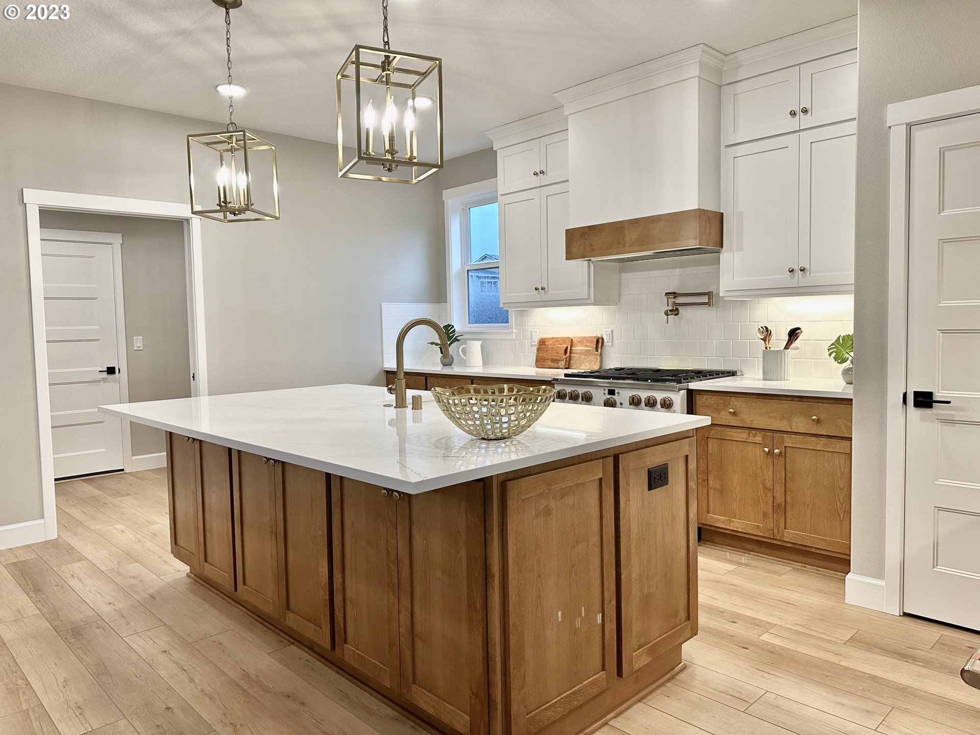 290 West Laurel Street Washougal, WA 98671 - Photo 8 of 20 a kitchen with stainless steel appliances a sink a stove a refrigerator and cabinets