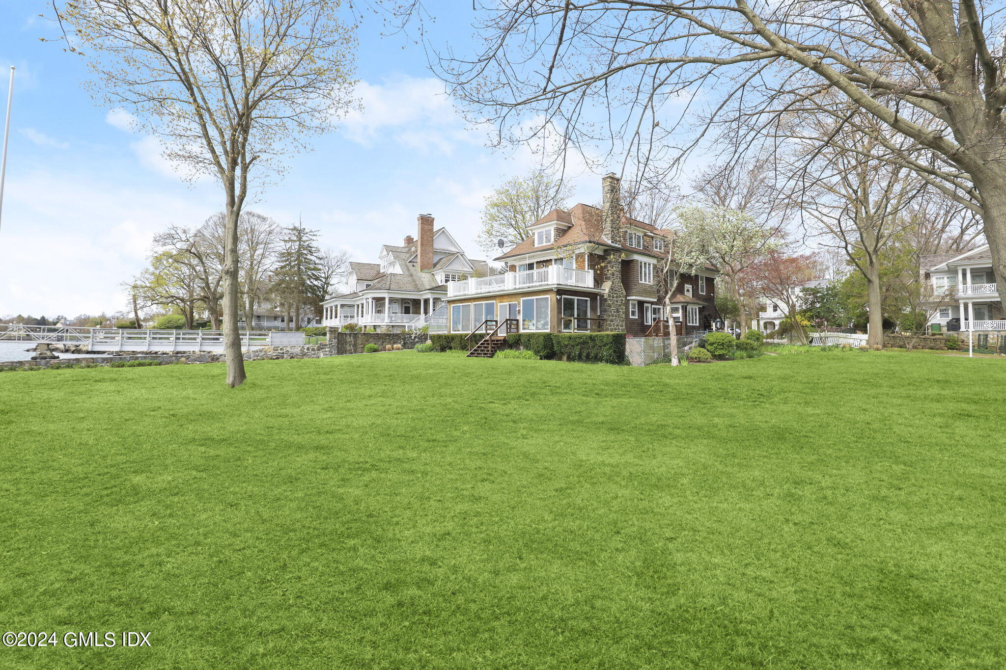 33 Byram Shore Road Greenwich, CT 06830 - Photo 3 of 16 a view of a park with large trees