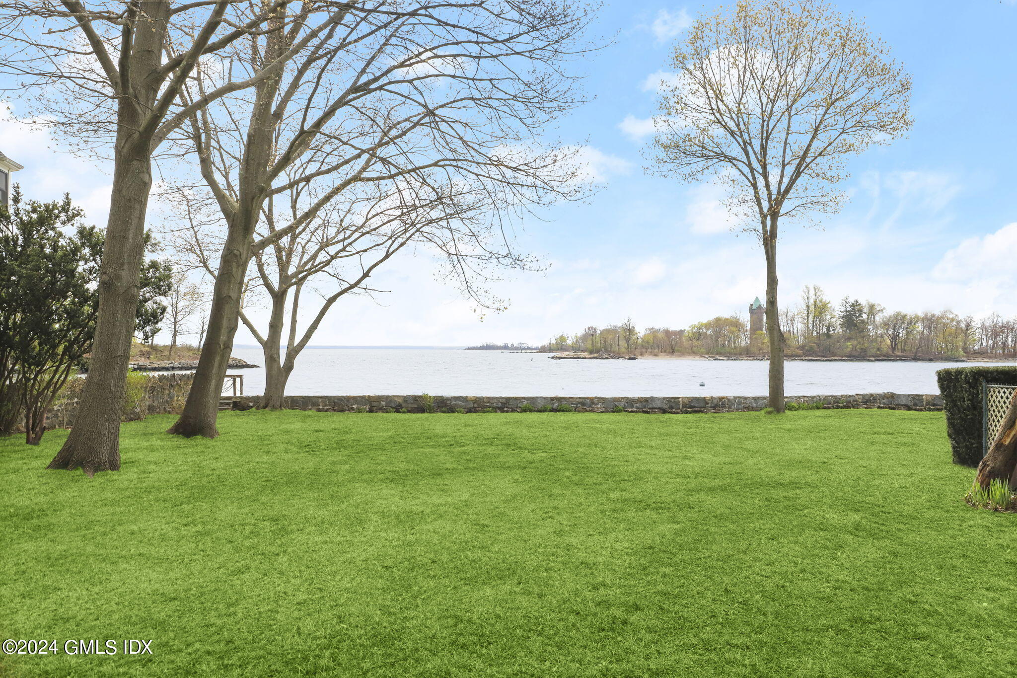 33 Byram Shore Road Greenwich, CT 06830 - Photo 6 of 16 a view of field with large trees