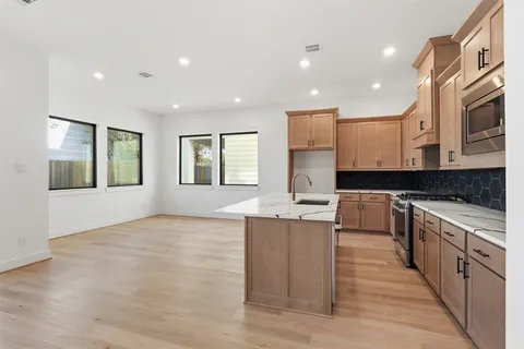 a spacious bedroom with a bed and a large window