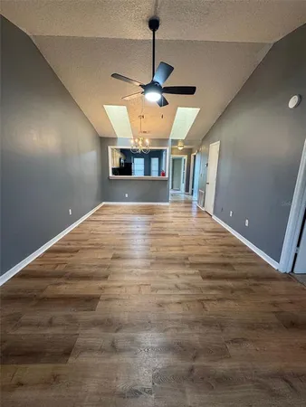 a view of a kitchen with a sink and a microwave