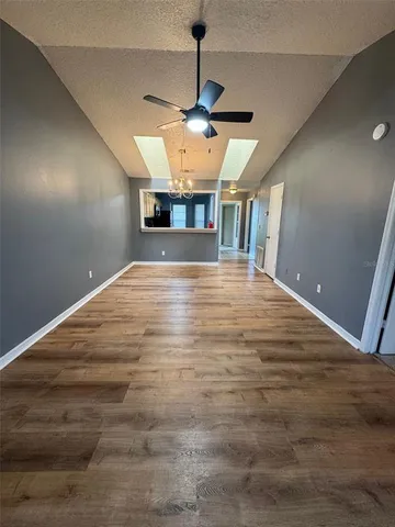 a view of a kitchen with a sink and a microwave