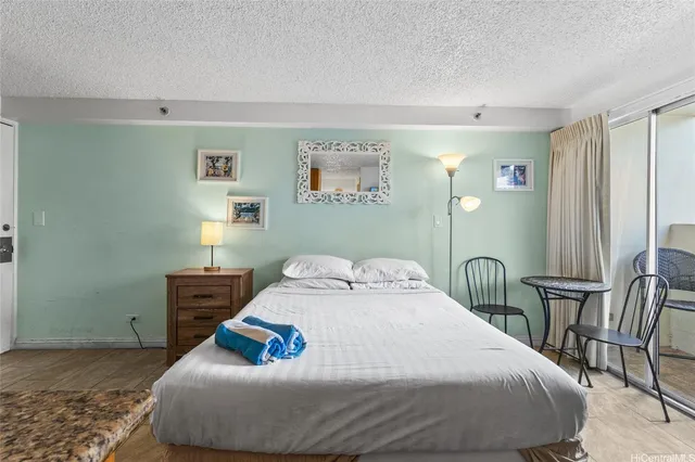 a bedroom with a bed and a table in it