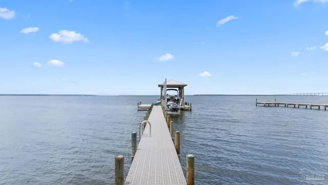 a view of a chairs and table in the patio