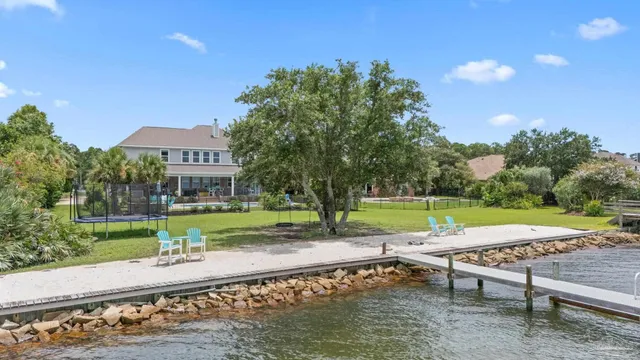 a view of a patio with a table and chairs