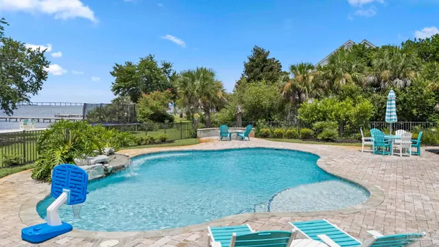 a front view of a house with a garden and yard