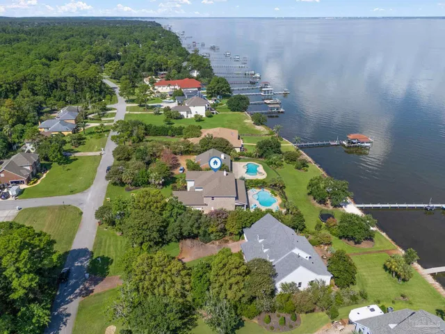 an aerial view of a house with garden space and street view