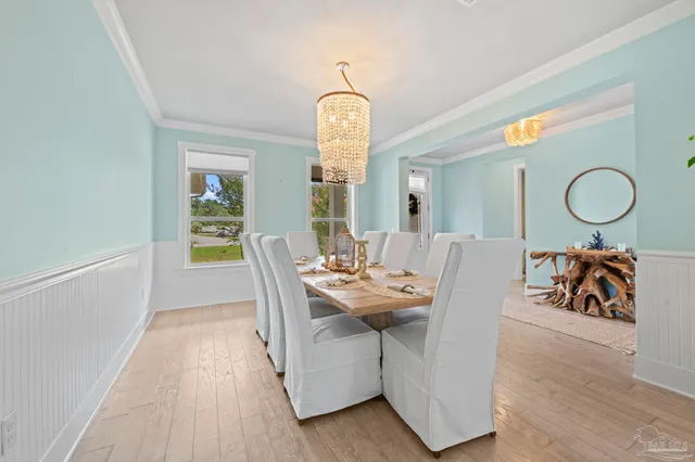 a kitchen with kitchen island stainless steel appliances a sink stove and cabinets