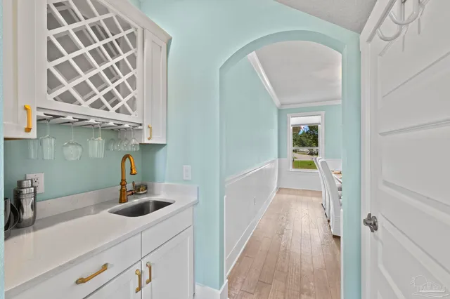 a bathroom with a stove a sink and a shower