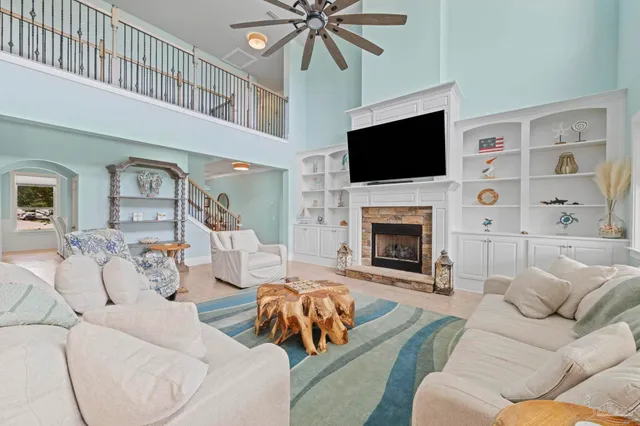 a spacious bedroom with a bed and a flat screen tv