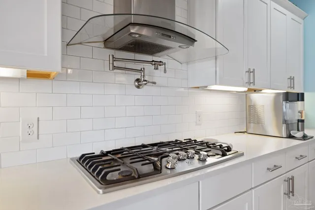 a bedroom with a bed and a dresser in it