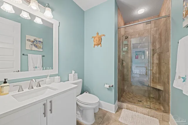 a bedroom with furniture and a chandelier