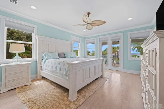 a bathroom with a granite countertop sink a toilet a mirror and shower